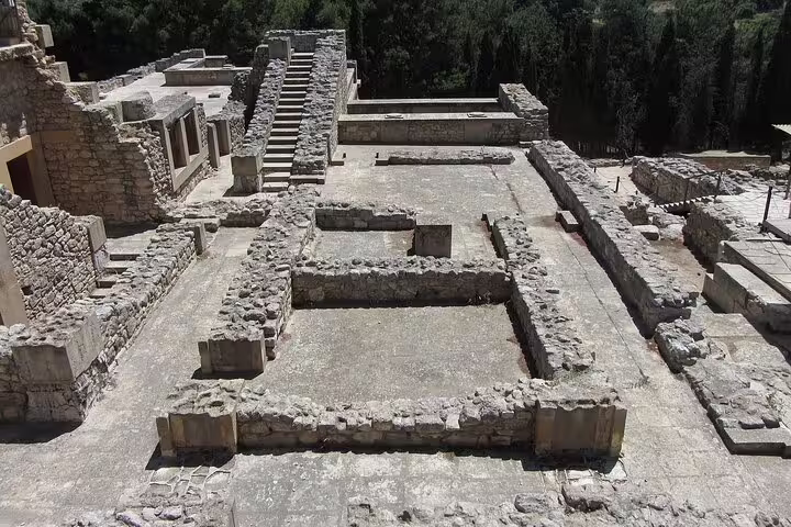 Ancient ruins of Knossos Palace on a sunny day, showcasing Minoan architecture and history in Heraklion, Crete.