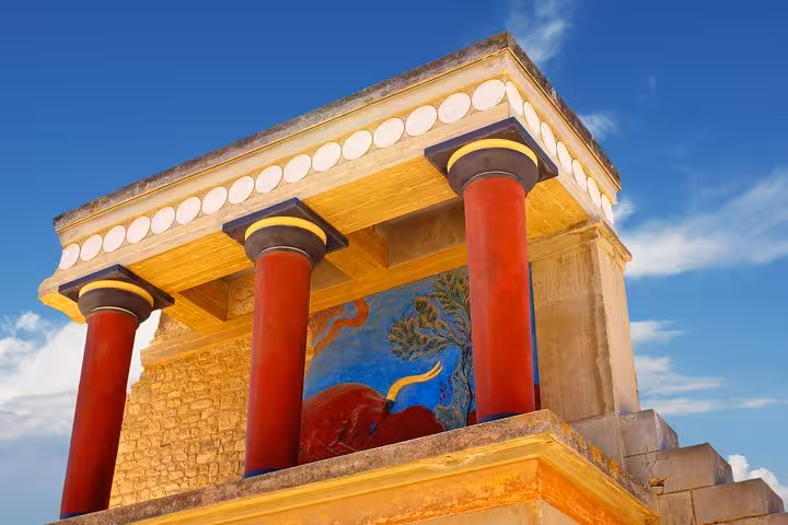 Knossos Palace red columns and Minoan fresco detail, must-see on Knossos & Heraklion City day tour from Rethimno