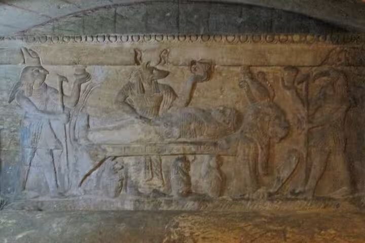 Ancient relief carving inside Kom El Shoqafa Catacombs, Alexandria on Cairo to Alexandria day trip with lunch