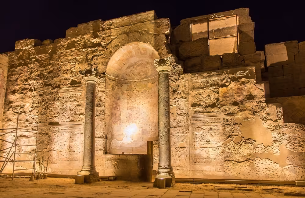 Illuminated Kom Ombo Temple wall carvings at night, a highlight on an 8-day budget Nile cruise in Egypt