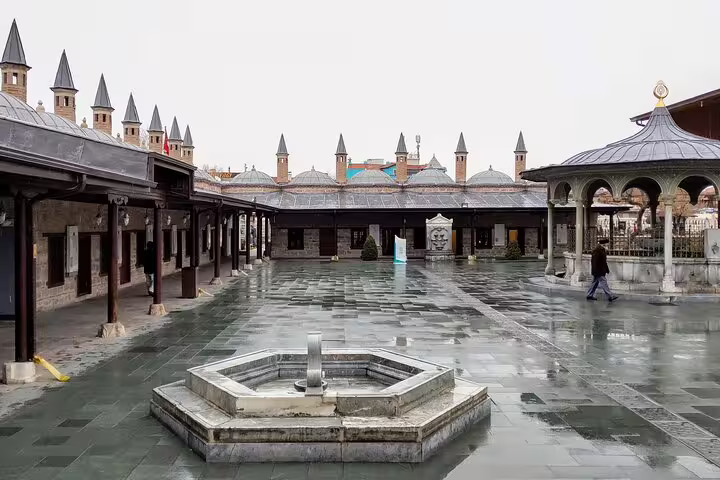 Stone courtyard and fountain at Konya Mevlana Museum complex, part of 8-day mini group Turkey tour
