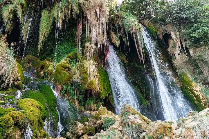 Close-up of Kravice Waterfalls mossy cliffs and cascading streams, scenic stop on Mostar tour