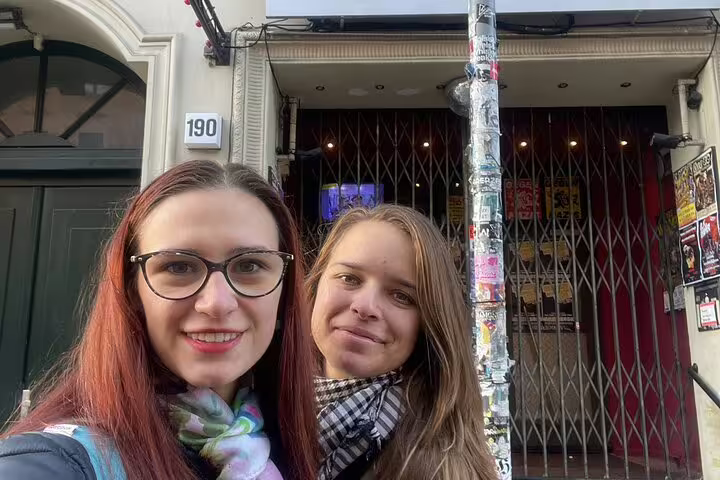 Two women taking a selfie in front of building number 190 in Kreuzberg, Berlin