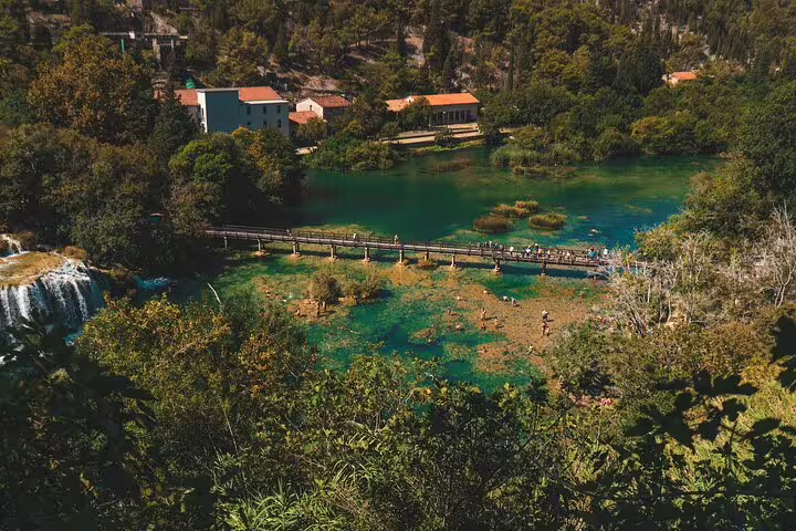Aerial view of Krka Waterfalls boardwalk and emerald pools, a highlight on food and wine tasting tour
