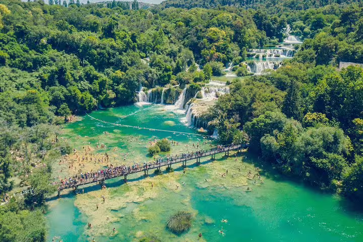 Aerial view of Krka National Park waterfalls and boardwalk, popular on scheduled Krka food and wine tour