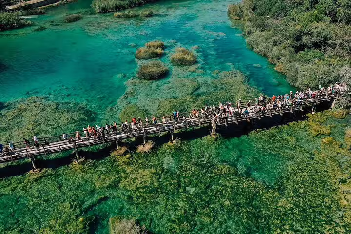 Aerial view of boardwalk over turquoise pools in Krka National Park on a private Krka Waterfalls day tour