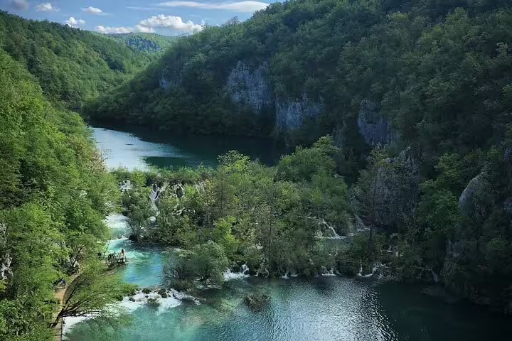Panoramic Plitvice Lakes view with turquoise cascades, ideal day trip from Split guided group tour