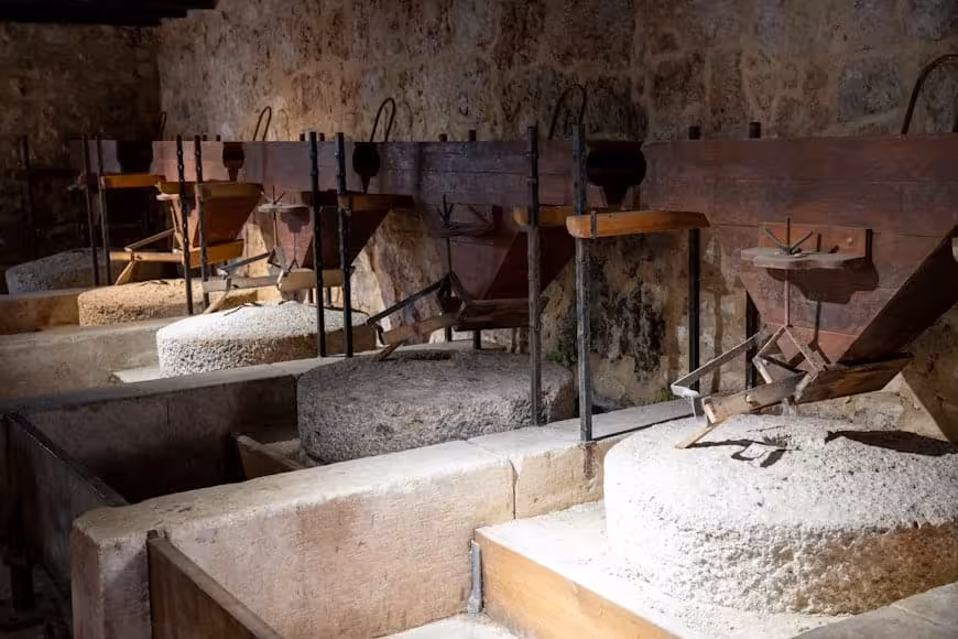 Traditional watermill exhibit at Krka National Park on a Krka Waterfalls group tour from Split