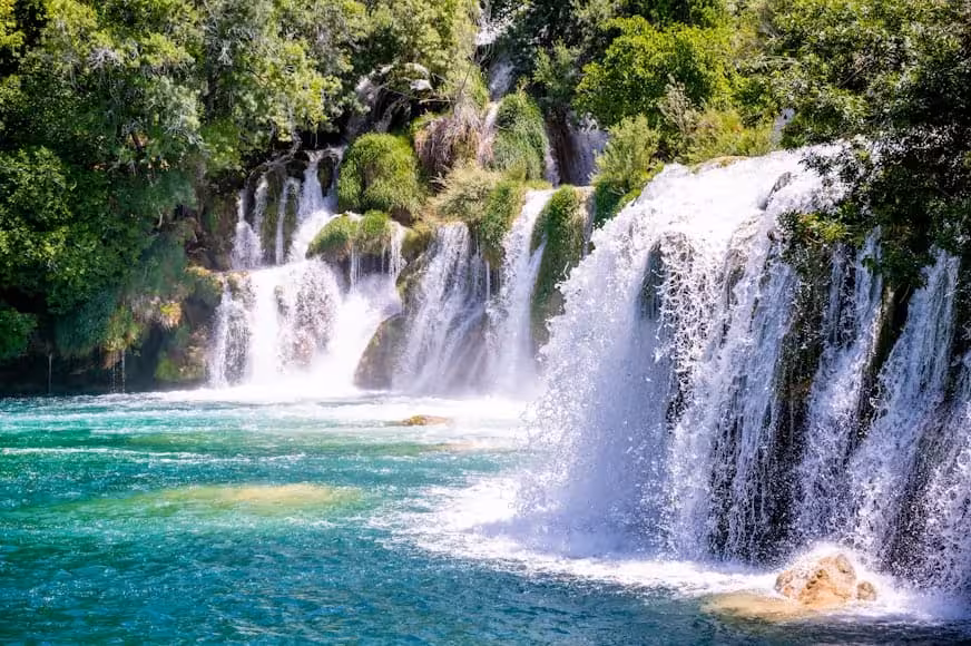 Scenic cascades and turquoise pools at Krka Waterfalls, Croatia, on a guided group day trip