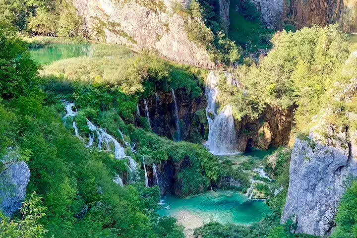 Plitvice Lakes guided group tour from Split with cascading waterfalls and turquoise pools in Croatia