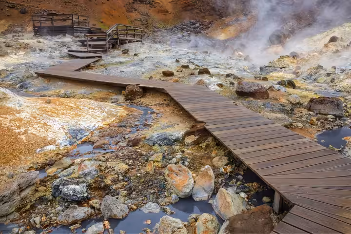 Wooden boardwalk over steaming geothermal hot springs at Krysuvik on Reykjanes Peninsula Iceland
