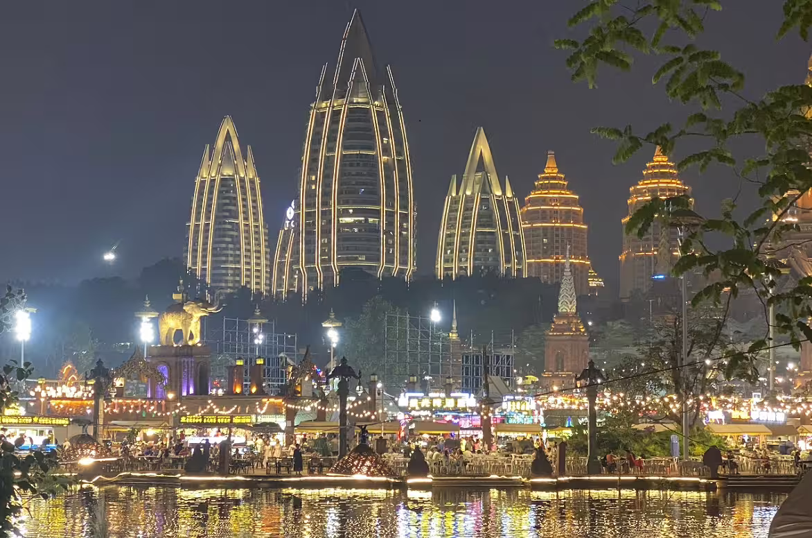 Illuminated skyline of Kunming at night, highlighting modern architecture for the Tea and Horse tour.