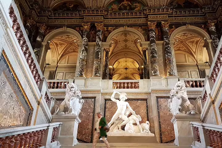 Grand staircase with ornate sculptures and architecture at the Kunsthistorisches Museum, Vienna.
