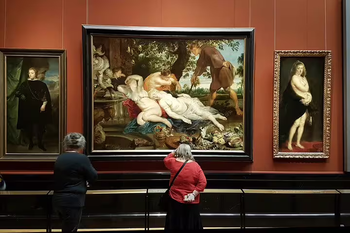 Visitors admiring classic masterpieces in the Kunsthistorisches Museum during exclusive private guided tour.