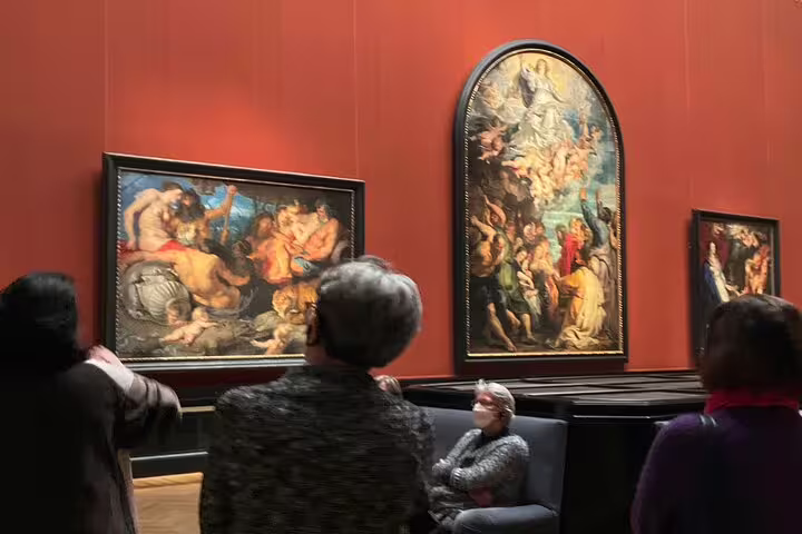 Visitors admire classic paintings in Kunsthistorisches Museum Vienna's gallery during a private art historian tour.