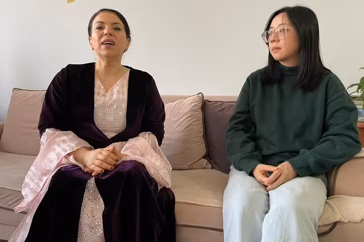 Kurdish dengbej vocalist in traditional dress hosting a private Istanbul music session with guest