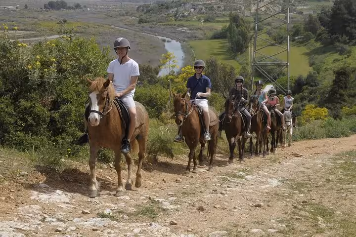Travelers horseback riding in Kusadasi countryside after Ephesus tour, scenic trail ride from port excursion