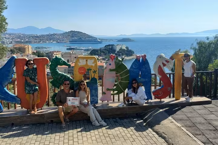 Kusadasi waterfront viewpoint with colorful KUŞADASI sign, ideal stop on private Ephesus shore excursion