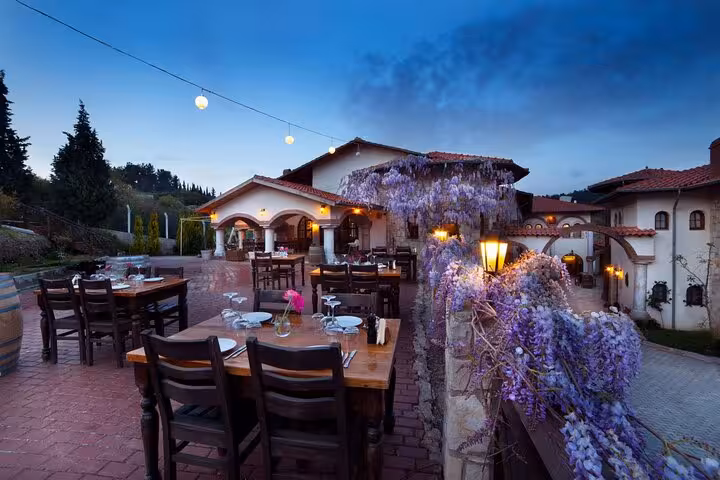 Outdoor winery terrace dinner setup near Kusadasi, ideal for private wine tasting after Ephesus tour