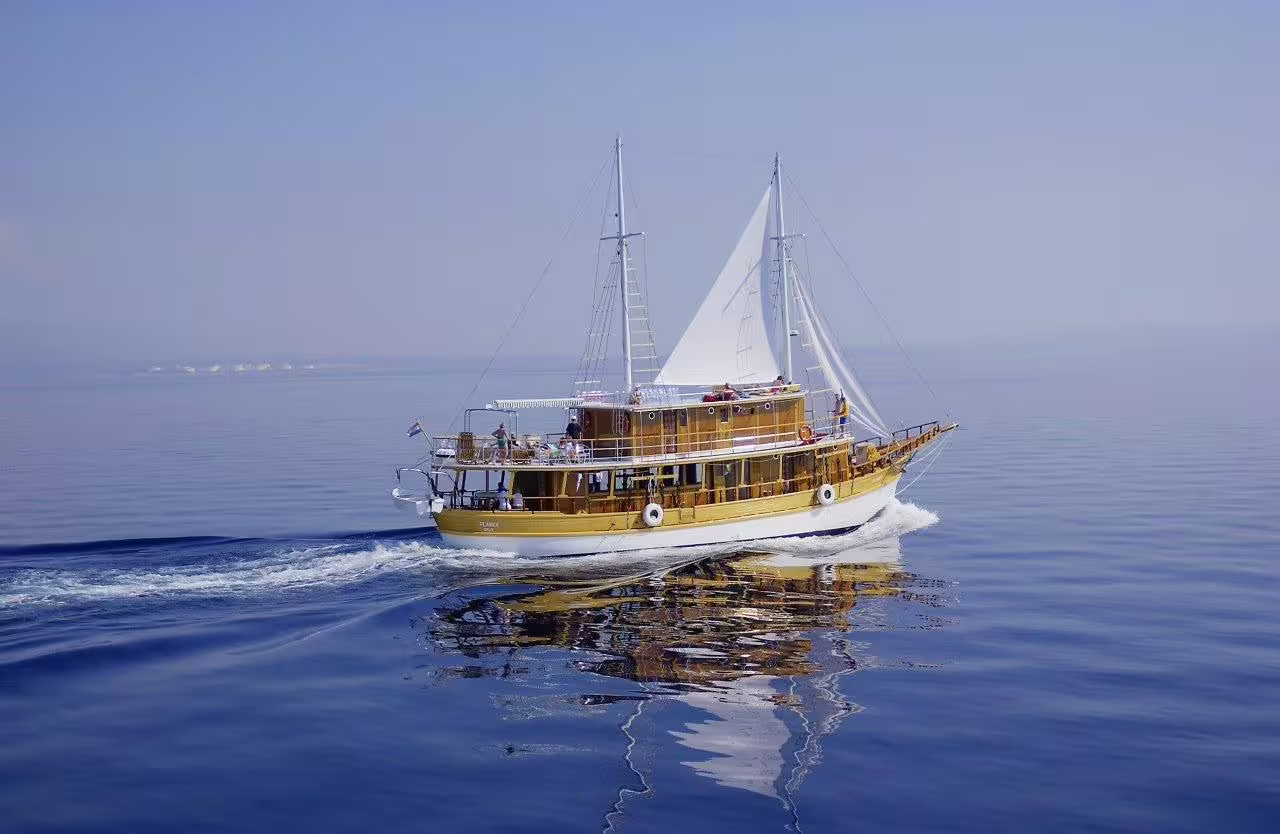 Standard boat sailing the Adriatic on Kvarner to North Dalmatia cruise, Croatia island-hopping route