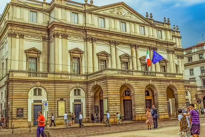 La Scala Opera House in Milan, Italy, bustling with tourists, ideal for a private 2 or 4-hour sightseeing tour experience.