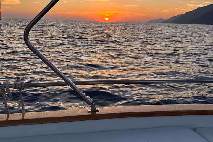 Stunning sunset over the sea captured from a boat during the La Spezia 3h boat tour of the 3 Islands.