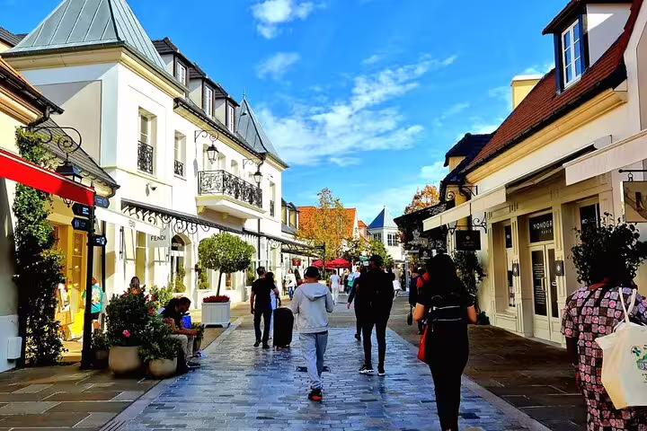 La Vallée Village shopping street near Paris, visited on private round-trip transfer for 1-3 persons