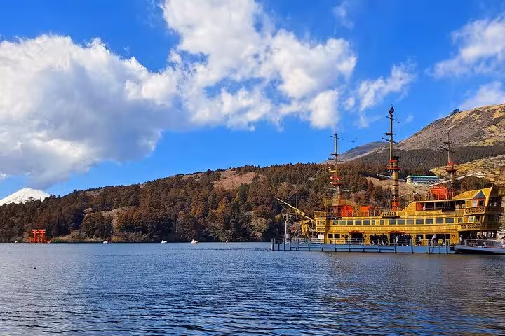 Scenic view of Lake Ashi with a pirate ship and Mount Fuji in the background on a clear day in Hakone.
