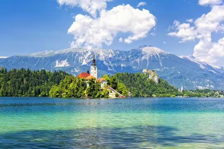 Lake Bled summer view with Bled Island church and Julian Alps, scenic boat ride and castle tour Slovenia