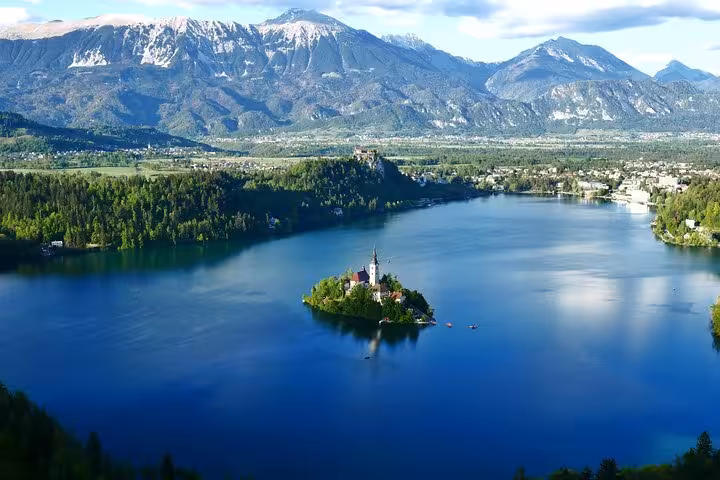 Lake Bled island church with Julian Alps backdrop, scenic stop on Budapest to Dubrovnik tour