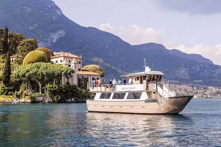 Private boat cruise on Lake Como near Bellagio villas, part of Milan to Como and Lugano royal cruise tour