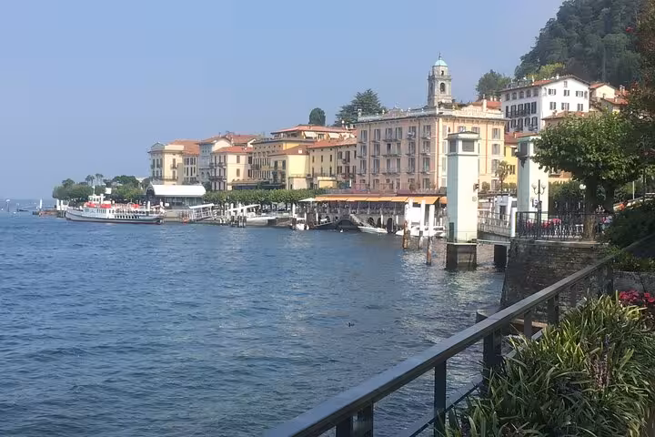 Lake Como promenade in Bellagio with harbor and historic buildings, part of guided Lugano and lake cruise tour