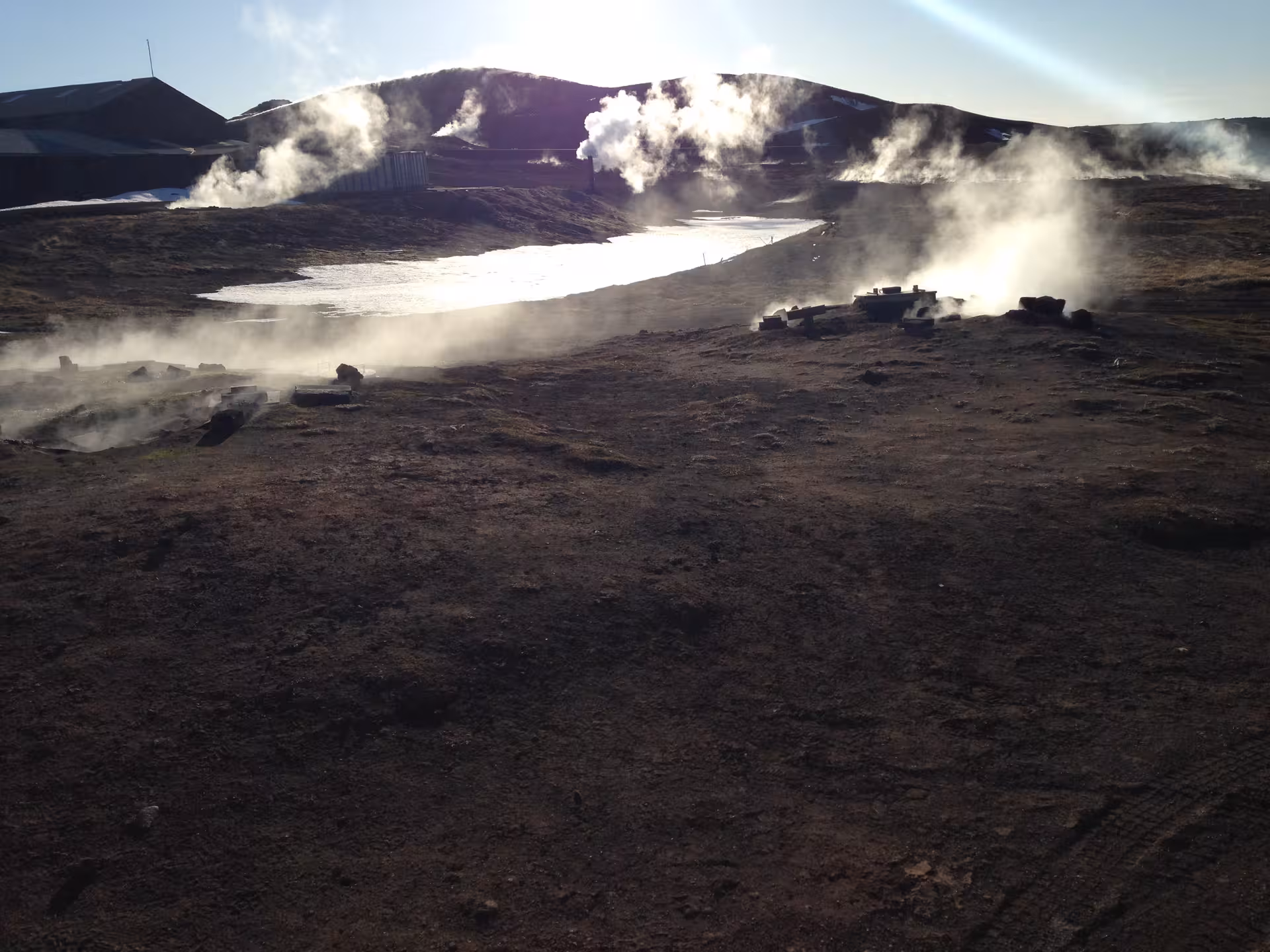 Geothermal steam rising over Lake Myvatn volcanic landscape on a guided Iceland nature day tour