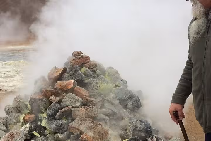 A geothermal steam vent at Lake Myvatn, showcasing Iceland's volcanic landscape on a guided cruise ship day tour.