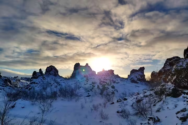 Snow-covered lava rock formations at sunset near Lake Myvatn, Iceland in winter