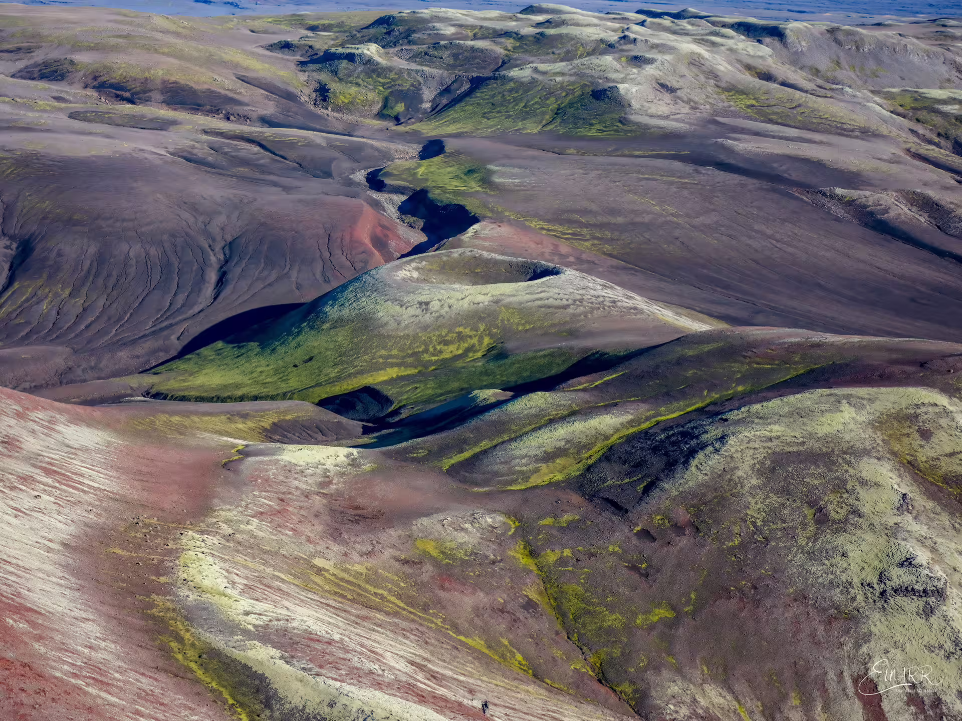 Aerial view of Laki volcanic craters with colorful moss-covered lava fields in Iceland's highlands