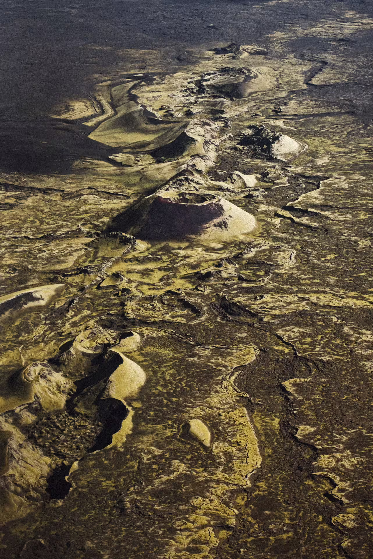 Aerial view of Laki volcanic craters row across Iceland lava fields from helicopter