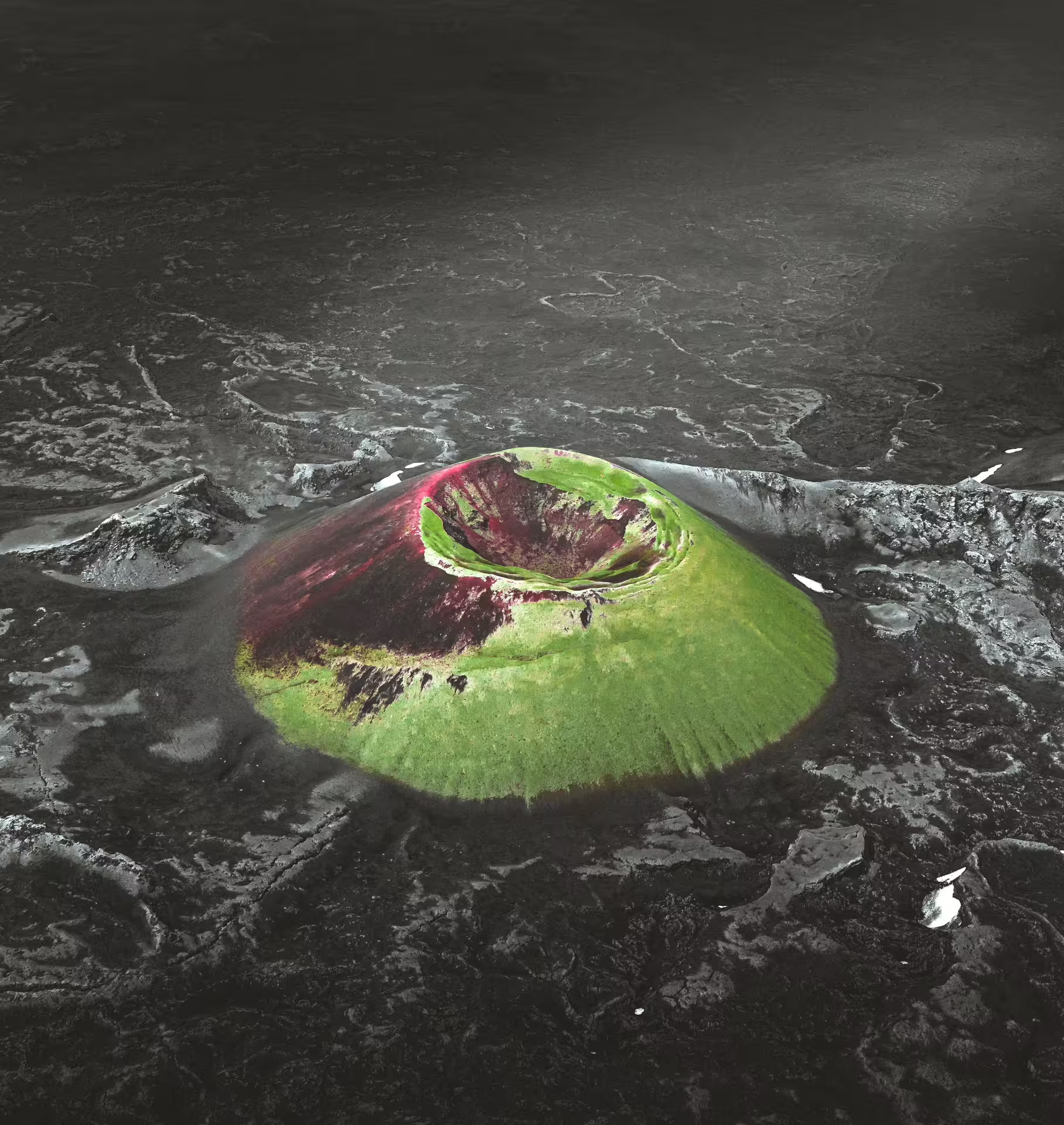 Aerial view of colorful Laki volcanic crater cone surrounded by dark lava fields in Iceland