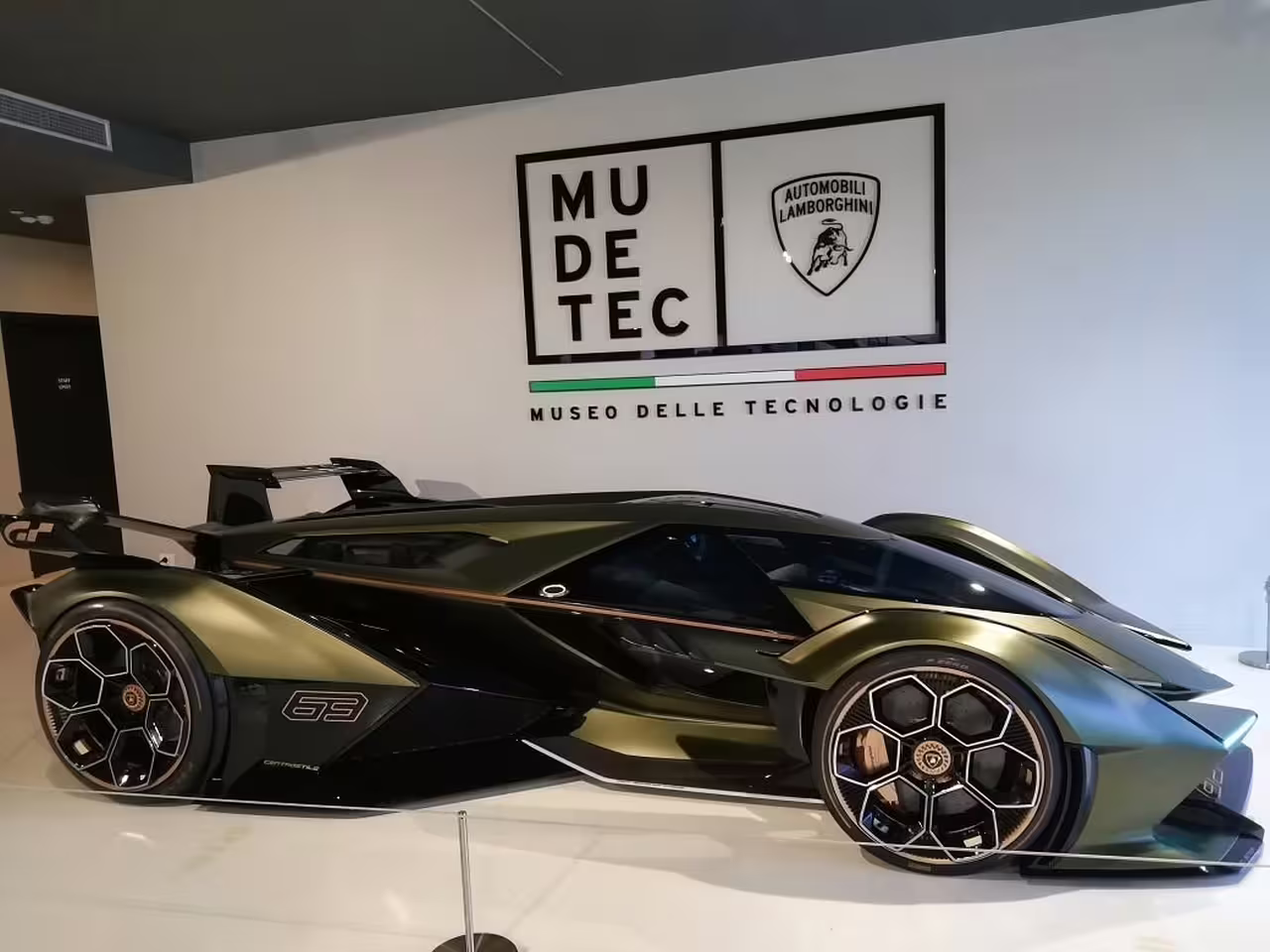 Futuristic Lamborghini concept car displayed at MUDETEC, highlighting cutting-edge design for Bologna tour visitors.