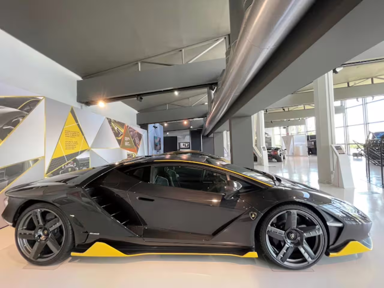 Sleek black Lamborghini on display at the Museo Lamborghini, highlighting its cutting-edge design and luxury features.