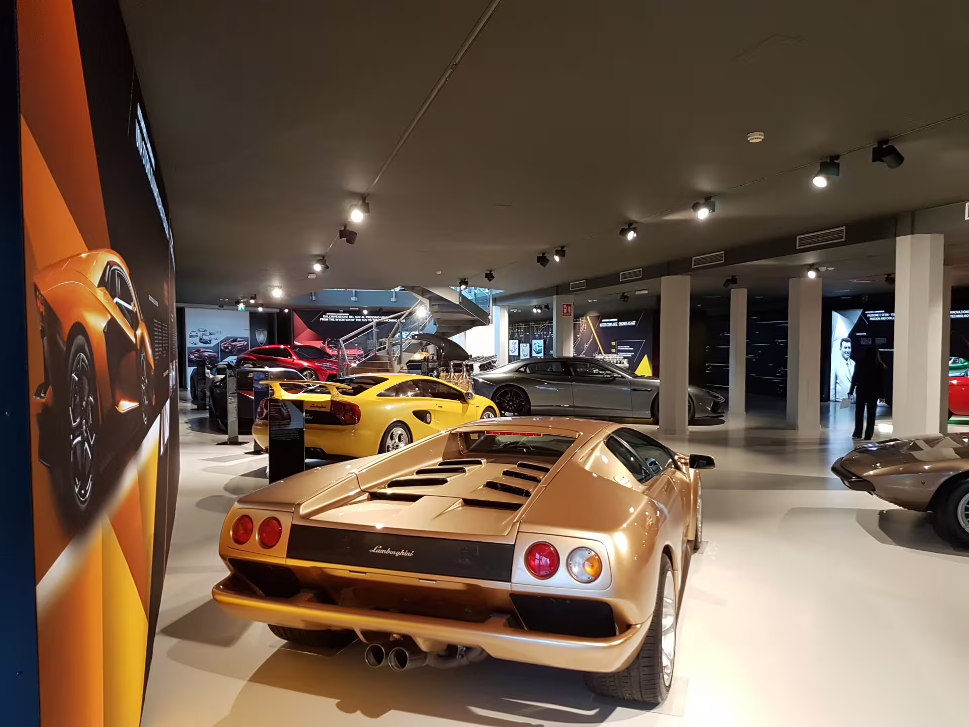 Lamborghini Museum Bologna entry: supercar gallery with classic and modern Lamborghini models on display
