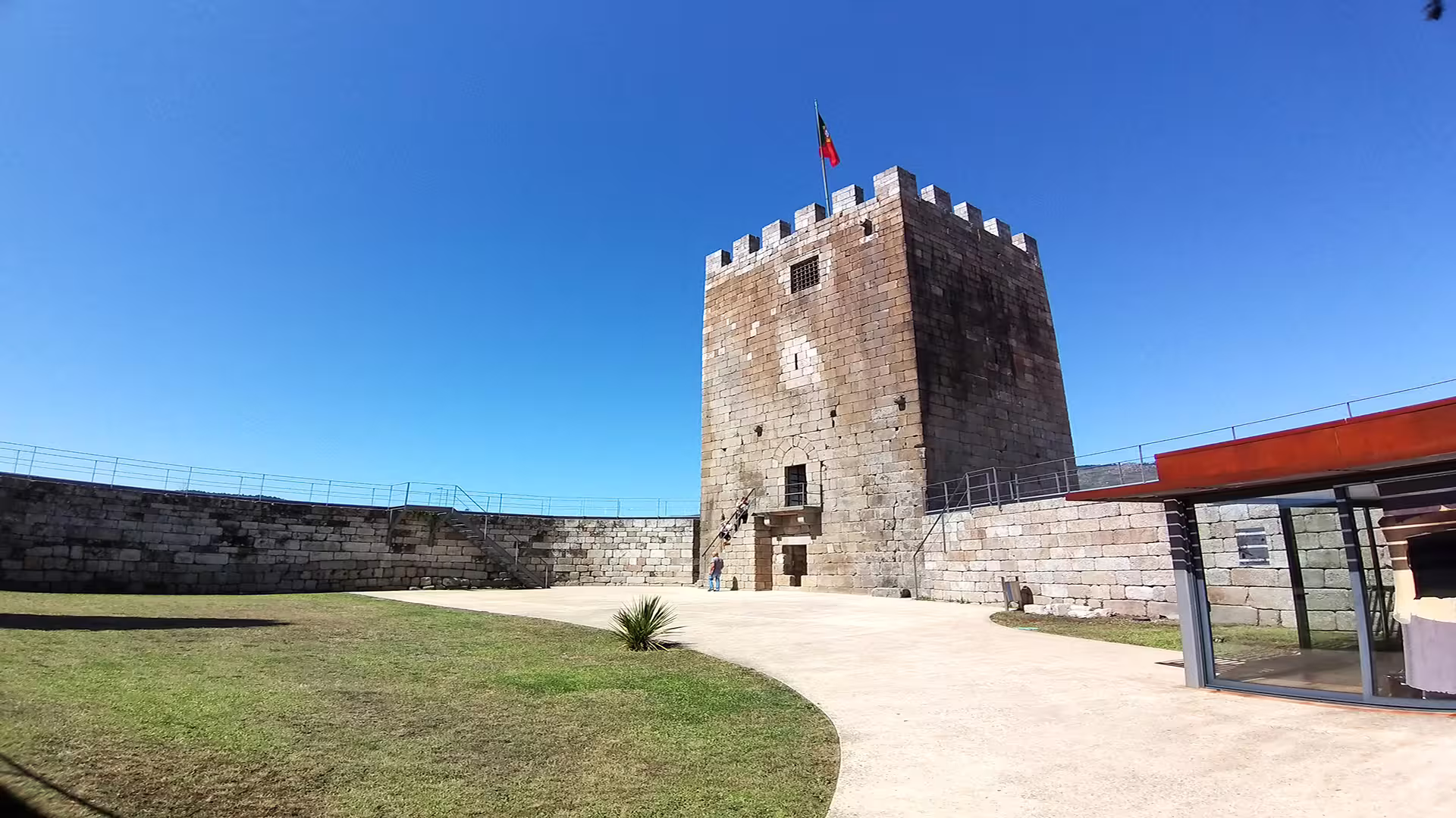 Medieval stone tower under clear blue sky, part of historic Lamego castle, a highlight of Dão wine region private tour.