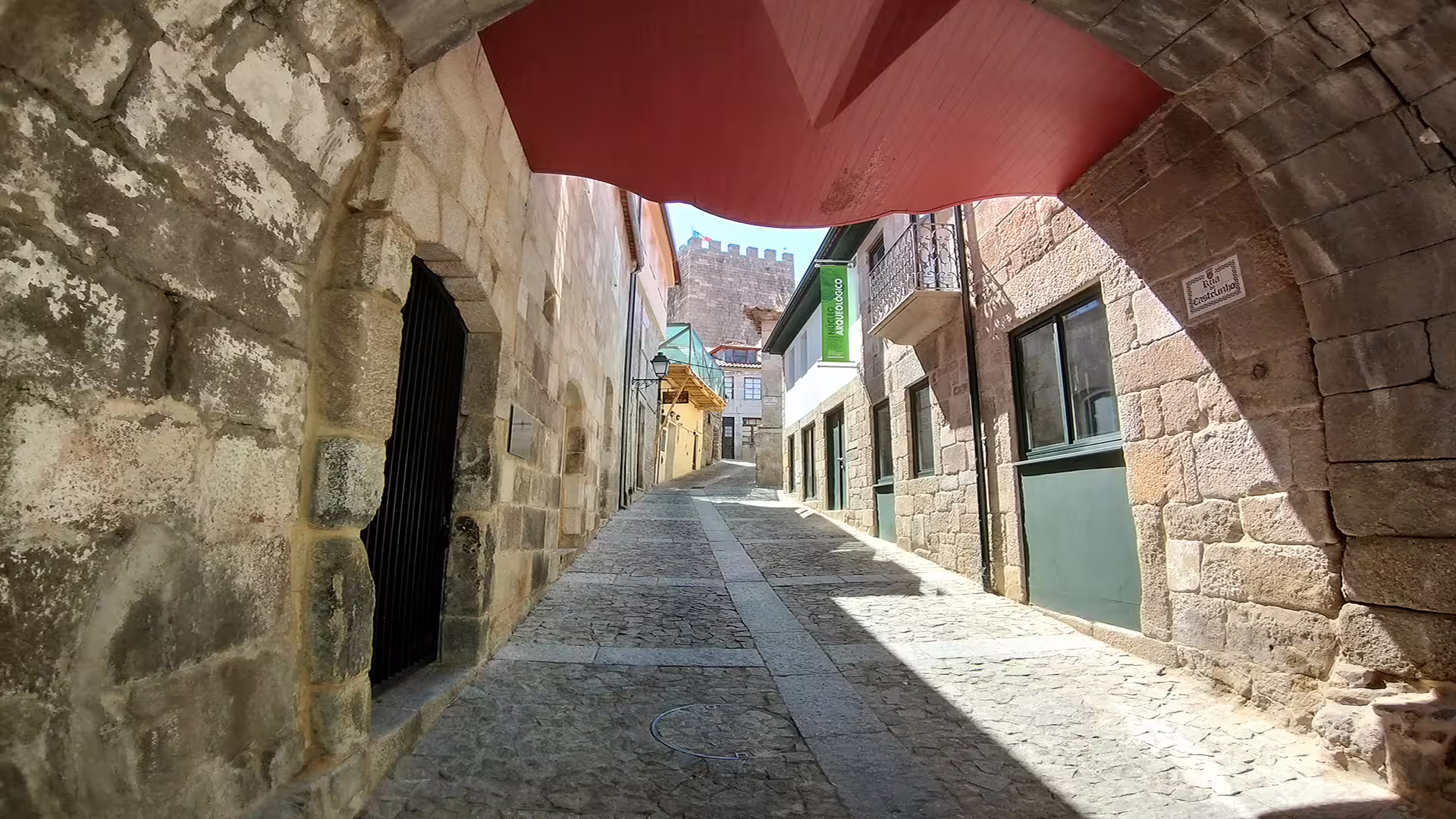 Charming narrow stone street in Lamego's historic center, showcasing medieval architecture during a private Dão wine region tour.