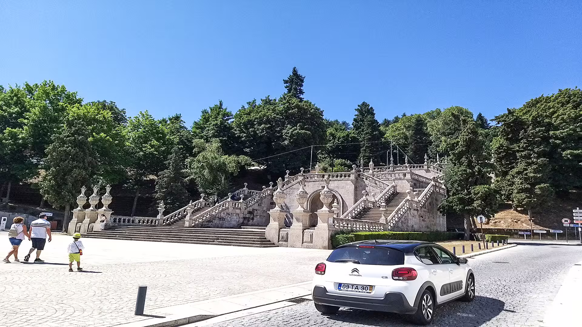 Scenic view of Lamego's iconic staircase surrounded by lush greenery, perfect for a private tour in the Dão wine region.