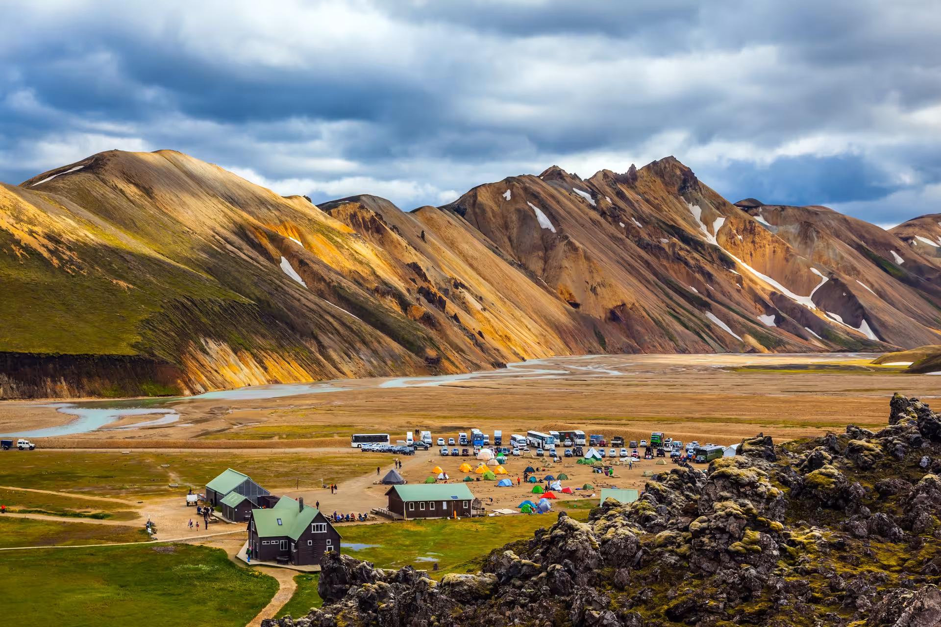 Scenic view of Landmannalaugar campsite with colorful rhyolite mountains, ideal for 4x4 super truck tours.