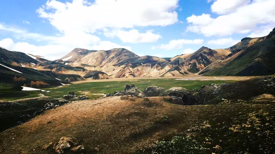 Colorful rhyolite mountains and green valley at Landmannalaugar Iceland on a sunny day