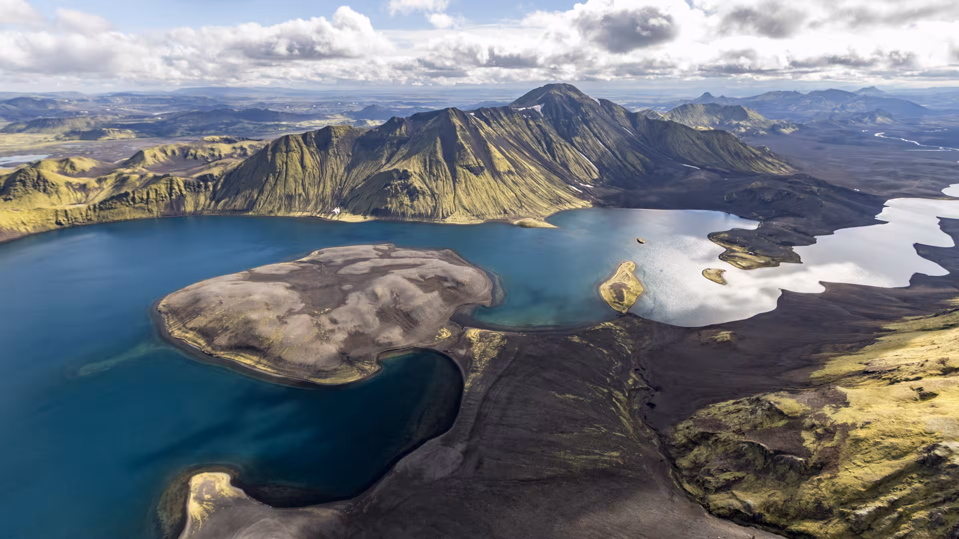Aerial view of Landmannalaugar volcanic lakes and green mountains in Iceland's highlands