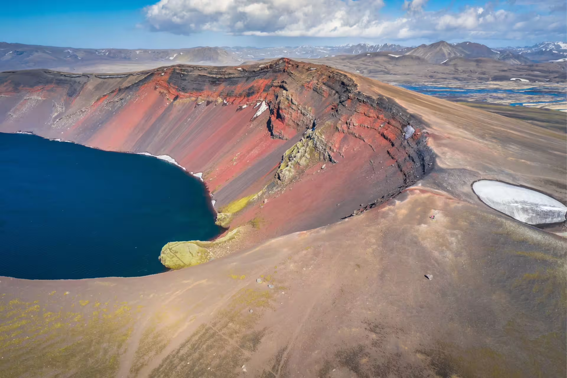 Aerial view of Ljótipollur red volcanic crater lake in Landmannalaugar Iceland highlands