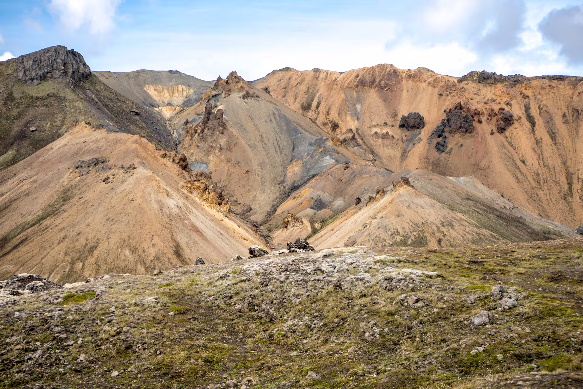 Colorful rhyolite mountains of Landmannalaugar with volcanic rock formations and mossy foreground