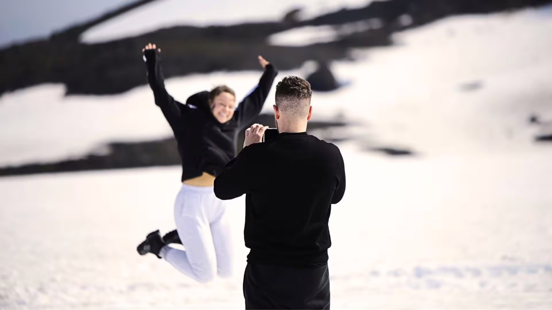 Traveler snaps photo of friend jumping on Langjökull glacier during Ice Cave and Glacier tour from Gullfoss